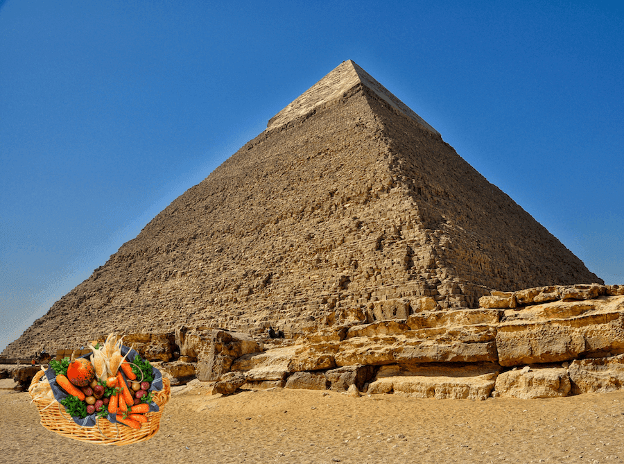 A photo of an Egyptian pyramid with a produce basket in front
