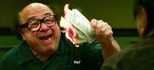 A gif showing Frank from "It's Always Sunny in Philadelphia" holding money that he lit on fire.
